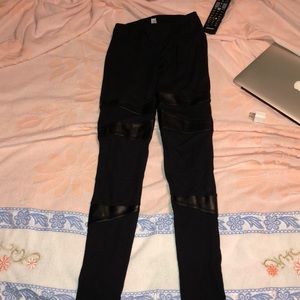 Black leggings with faux leather inserts
